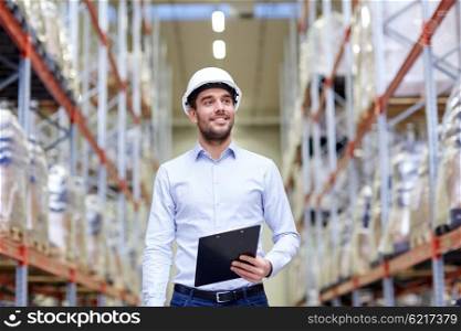 wholesale, logistic, business, export and people concept - happy man or manager with clipboard at warehouse