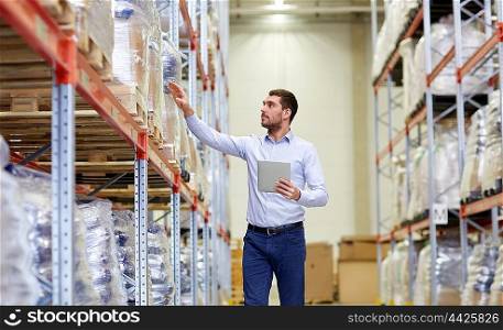 wholesale, logistic, business, export and people concept - man or manager with tablet pc computer checking goods at warehouse