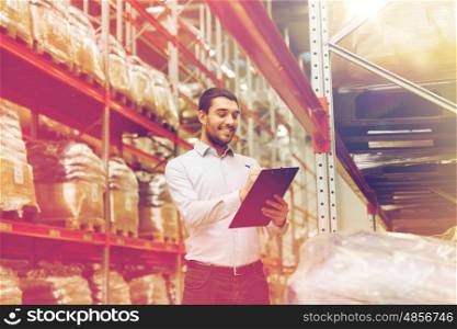 wholesale, logistic, business, export and people concept - man or manager with clipboard checking goods at warehouse
