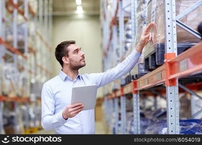 wholesale, logistic, business, export and people concept - man or manager with tablet pc computer checking goods at warehouse