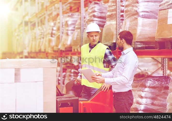 wholesale, logistic, loading, shipment and people concept - loader on forklift and businessman with tablet pc computer at warehouse