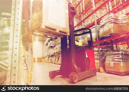 wholesale, logistic, loading, shipment and people concept - man or loader on forklift loading cargo at warehouse