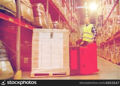 wholesale, logistic, loading, shipment and people concept - man or loader on forklift loading cargo at warehouse. man on forklift loading cargo at warehouse