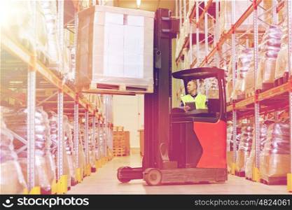 wholesale, logistic, loading, shipment and people concept - man or loader with tablet pc computer and forklift or loader loading boxes at warehouse