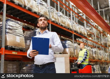 wholesale, logistic, people and export concept - businessman with clipboards at warehouse