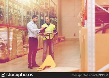 wholesale, logistic, people and export concept - manual worker and businessmen with loader and clipboard at warehouse