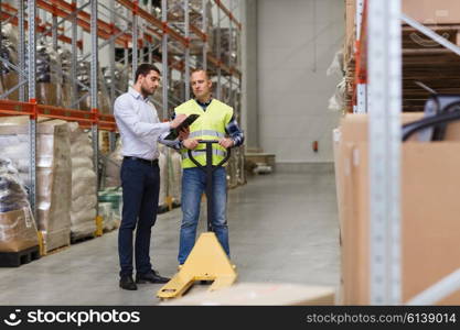 wholesale, logistic, people and export concept - manual worker and businessmen with loader and clipboard at warehouse