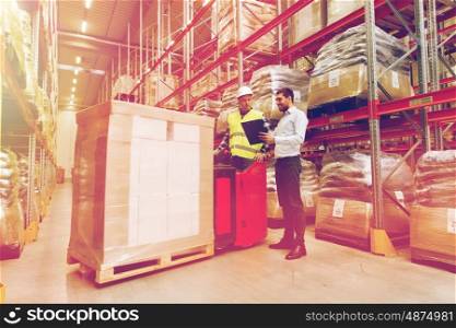 wholesale, logistic, people and export concept - manual worker on forklift loader and businessmen with clipboard at warehouse