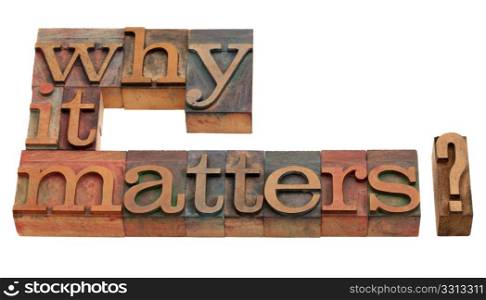 Why it matters? A question in vintage wooden letterpress printing blocks, isolated on white