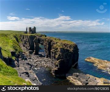Wick, United Kingdom - 26 June, 2022: view of the Caithness coast and the ruins of the historic Castle Sinclair Girnigoe