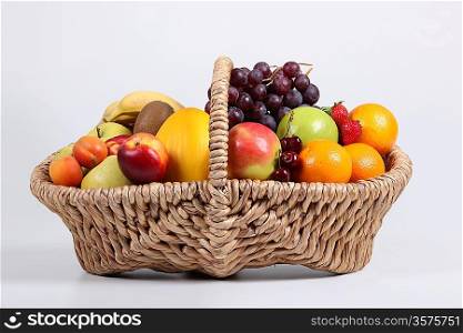 Wicker basket full of fresh fruit