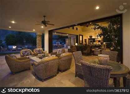 Wicker furniture in lit Palm Springs home
