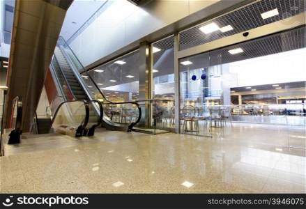 Wide angle shot of modern interior with escalator