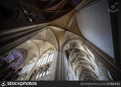 Wide angle view from the arhhitectural structure of the central nave in the cathedral of Tours in France