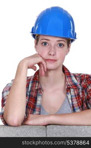 Wide eyed female construction worker