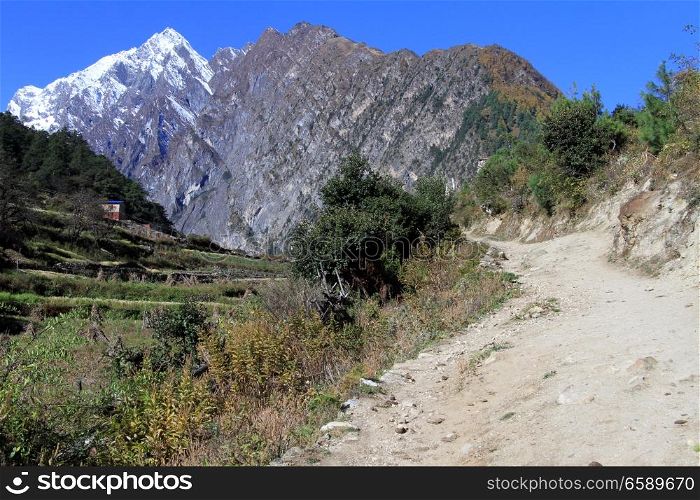 Wide footpath and field in mountain in Nepal