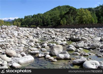 Wide mountain river with stones in south Turkey