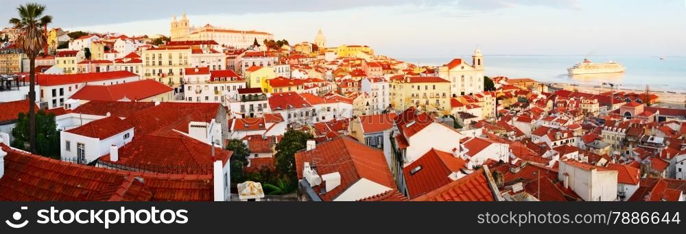 Wide panoramic view of Lisbon Old Town at sunset, Portugal