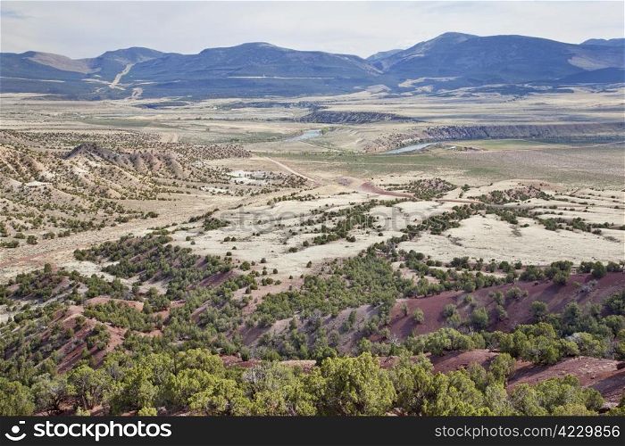 wide semiarid valley of Green River near Browns Park below Flaming Gorge Dam, Utah, early spring
