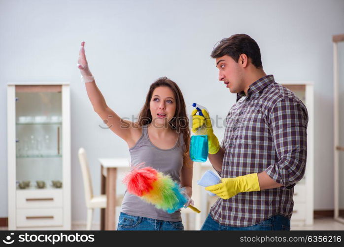 Wife and husband doing cleaning at home