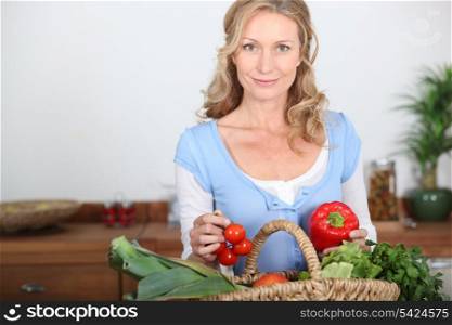 Wife holding pepper and tomatoes
