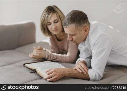 wife husband studying holy book