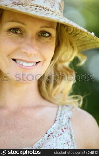 Wife wearing straw hat.
