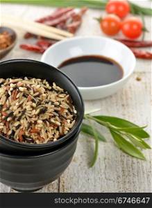 Wild Rice And A Soy Sauce In The Bowls