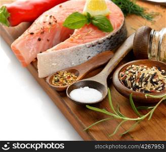 Wild Rice And Salmon With Spices On A Wooden Board