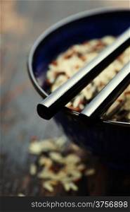 wild rice in ceramic bowl on wooden background
