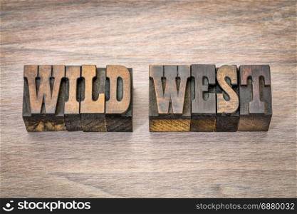 wild west banner - text in vintage letterpress wood type - French Clarendon font popular in western movies and memorabilia
