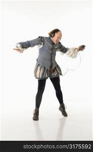 William Shakespeare in period clothing listening to mp3 player and dancing.