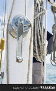 Winch handle and rope on yacht