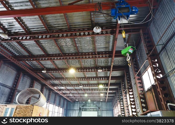 winch with overhead crane and scales in warehouse