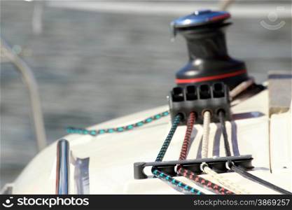 Winch with rope on sailing boat. Yacht detailed parts. Yachting Baltic sea summer vacation. Tourism luxury lifestyle.