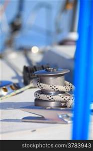 Winch with rope on sailing boat. Yachting yacht in blue baltic sea sunny day summer vacation. Tourism luxury lifestyle.
