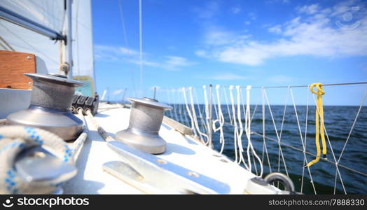 Winch with rope on sailing boat. Yachting yacht in blue baltic sea sunny day summer vacation. Tourism luxury lifestyle.