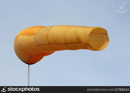 Wind direction Flag on blue cloud sky in wind