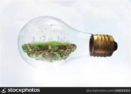 Wind energy. Eco energy concept with windmills inside of light bulb