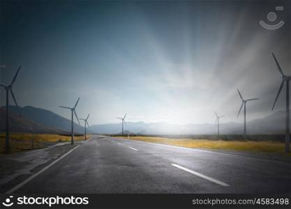 Wind energy. Some windmills standing in desert. Power and energy concept