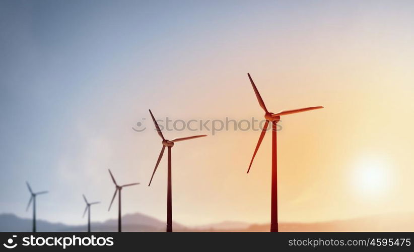 Wind energy. Some windmills standing in desert. Power and energy concept