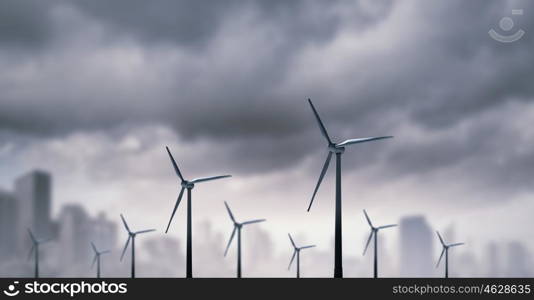 Wind energy. Some windmills standing in desert. Power and energy concept