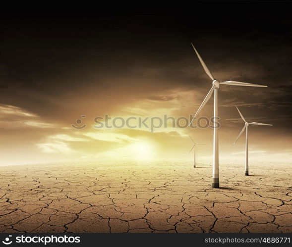 Wind energy. Some windmills standing in desert. Power and energy concept