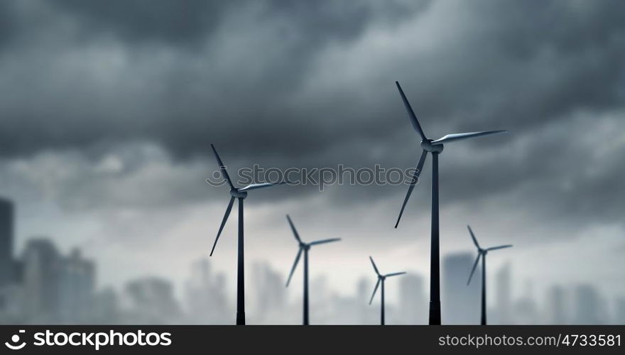 Wind energy. Some windmills standing in desert. Power and energy concept