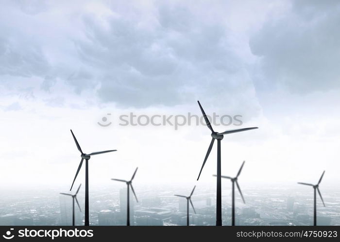 Wind energy. Some windmills standing in desert. Power and energy concept