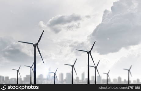 Wind energy. Some windmills standing in desert. Power and energy concept