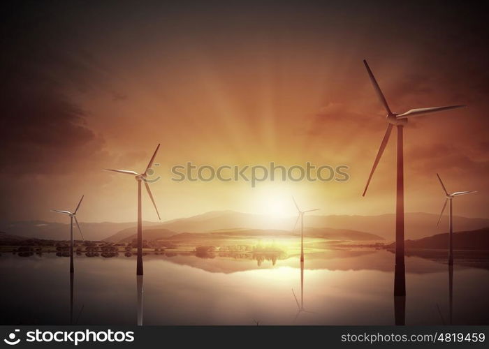 Wind energy. Some windmills standing in desert. Power and energy concept