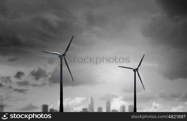 Wind energy. Some windmills standing in desert. Power and energy concept