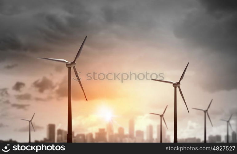 Wind energy. Some windmills standing in desert. Power and energy concept