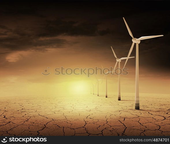 Wind energy. Some windmills standing in desert. Power and energy concept